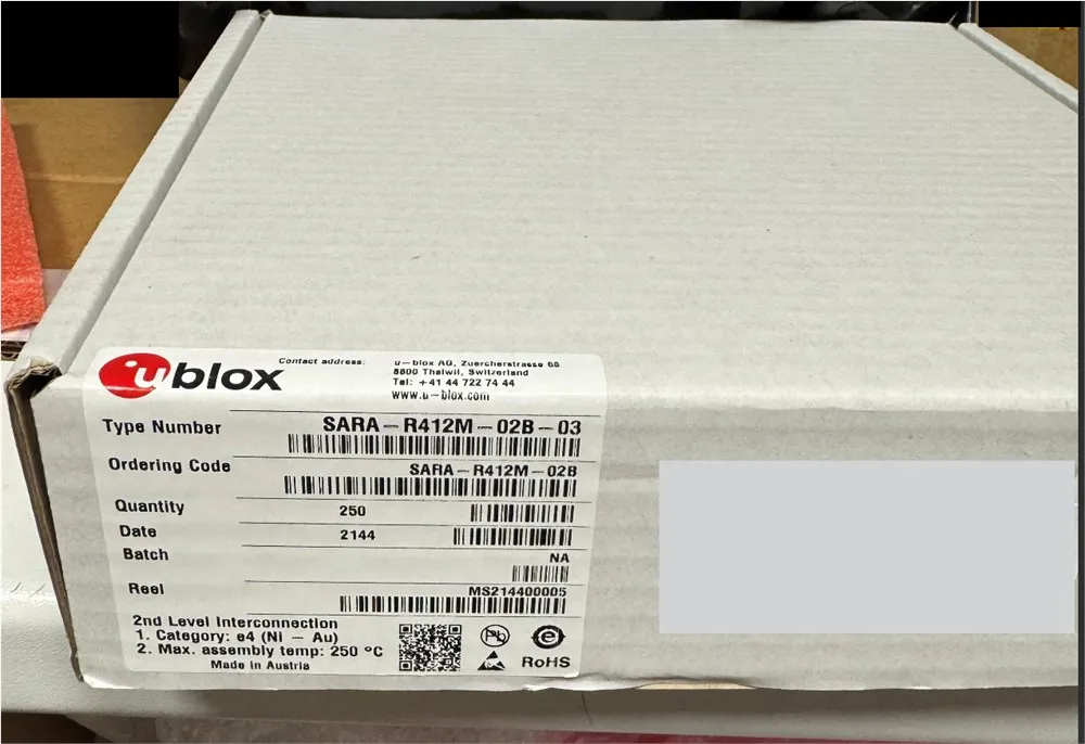 Gray cardboard box with a u-blox label reading SARA-R412M-02B-03, quantity 250, with part of the label blanked out