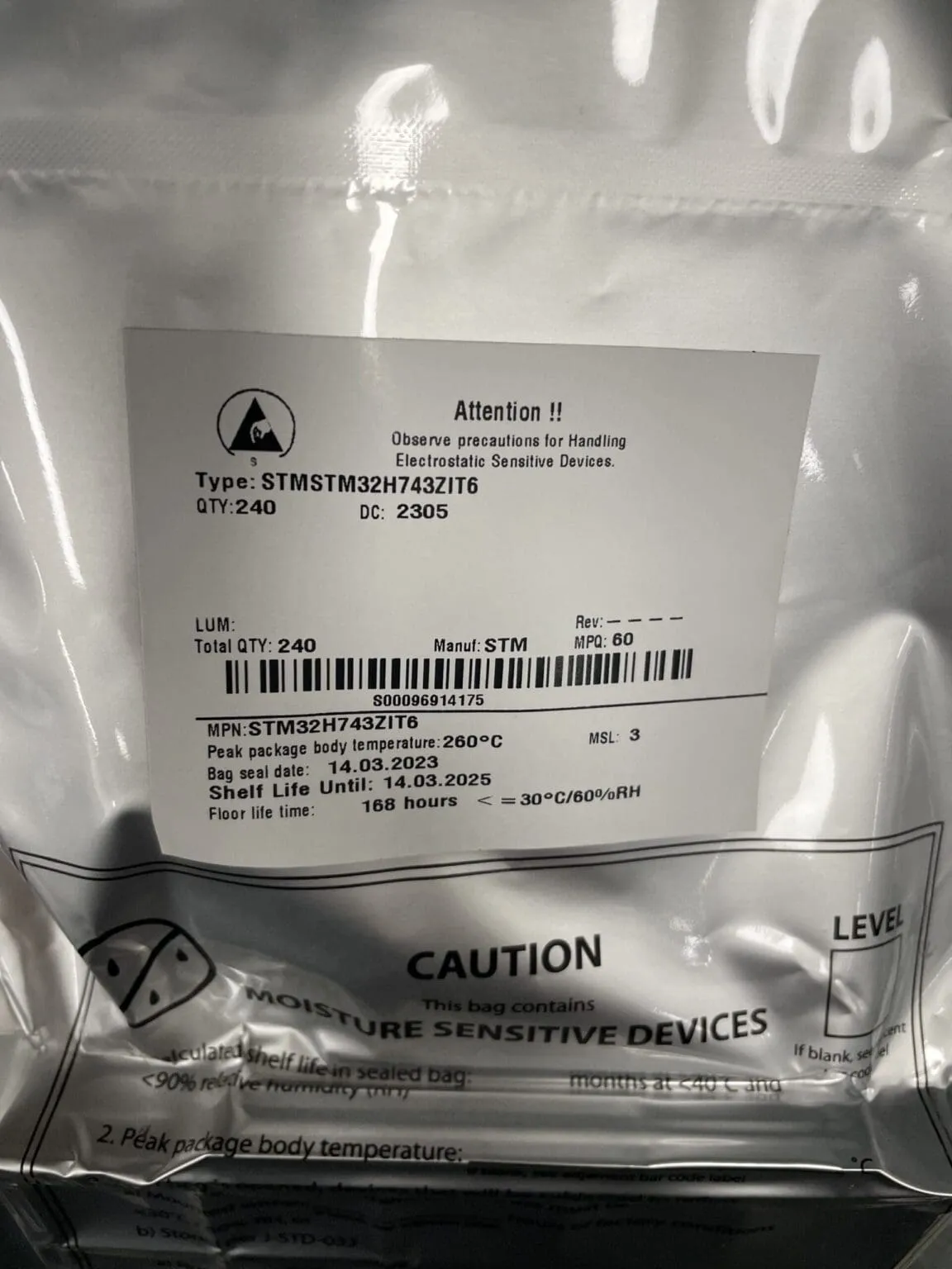 Silver moisture barrier bag with a label reading STM32H743ZIT6, quantity 240, and an ESD warning symbol