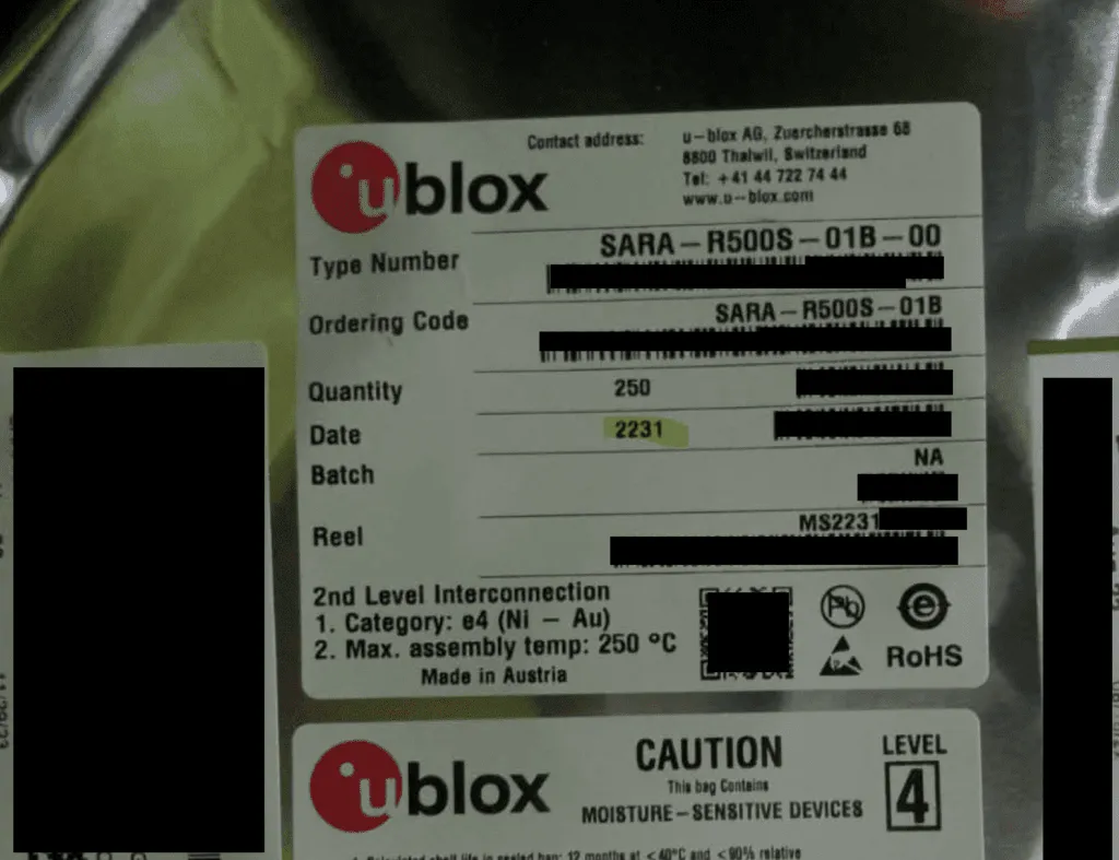 u-blox reel label reading SARA-R500S-01B-00, quantity 250, with parts blacked out, above a moisture-sensitive caution label