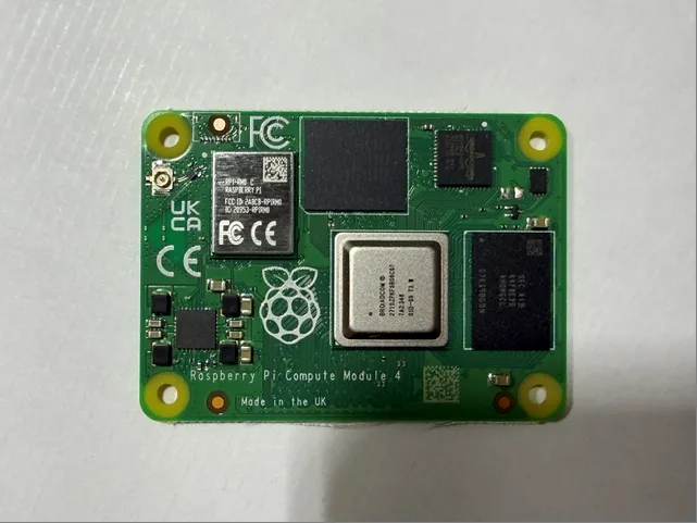 Top side of a Raspberry Pi CM4101008 module showing the BCM2711, eMMC and the wireless module