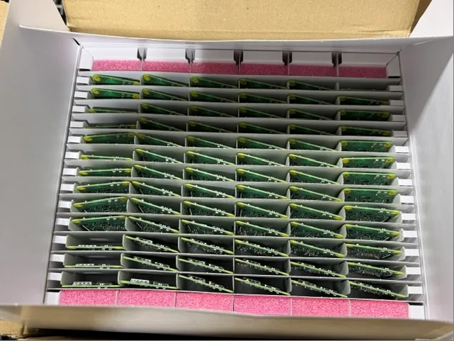 Open carton of Raspberry Pi CM4101008 units in anti-static trays